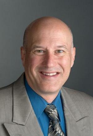 A headshot of Dr. Greg Newton